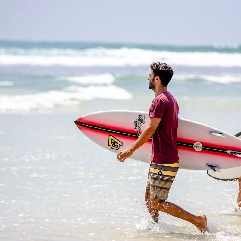 Surfing at Narigama Beach